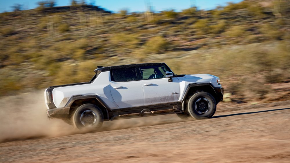 The 2022 Hummer EV Pickup being driven off-road.
