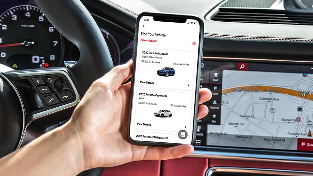 A phone displaying the Porsche Drive subscription and rental app.