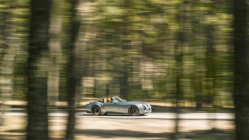 The Weismann Project Thunderball EV driving through a forest