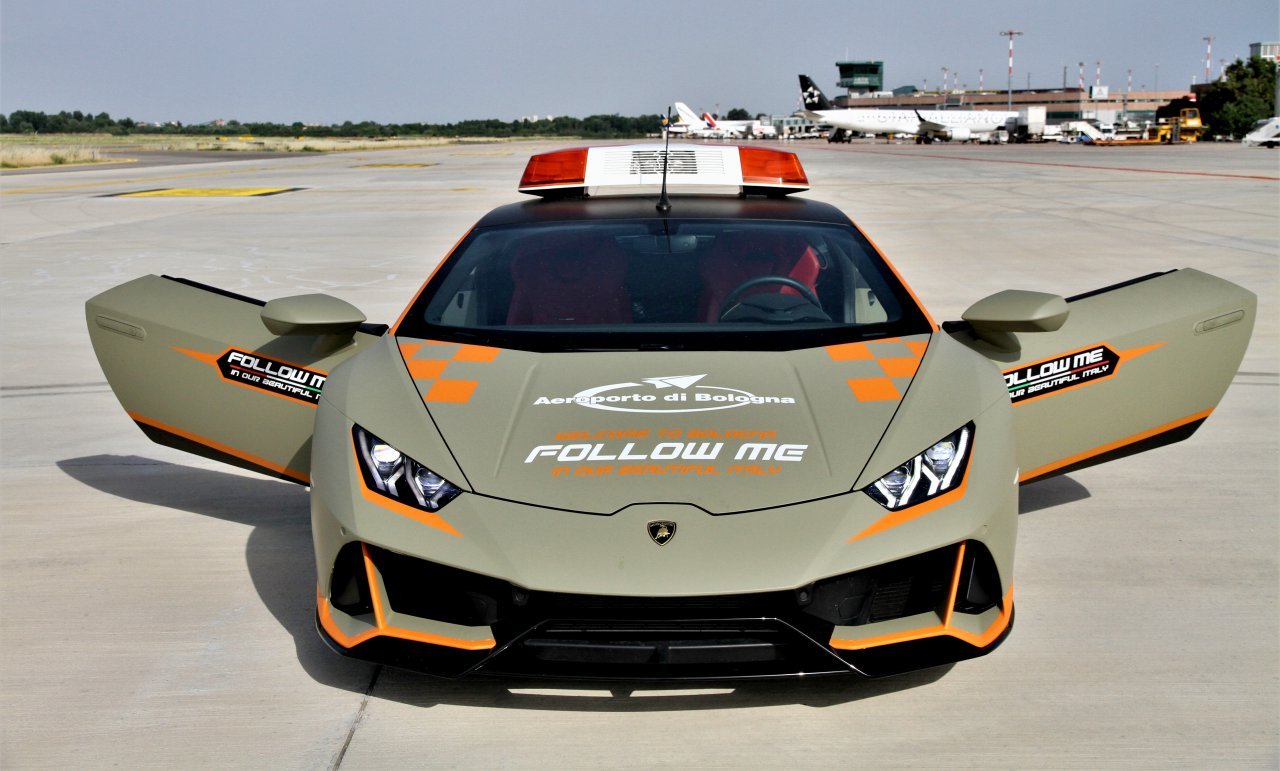 Lamborghini, Wonder if the aircraft can keep up with the Lamborghini, ClassicCars.com Journal
